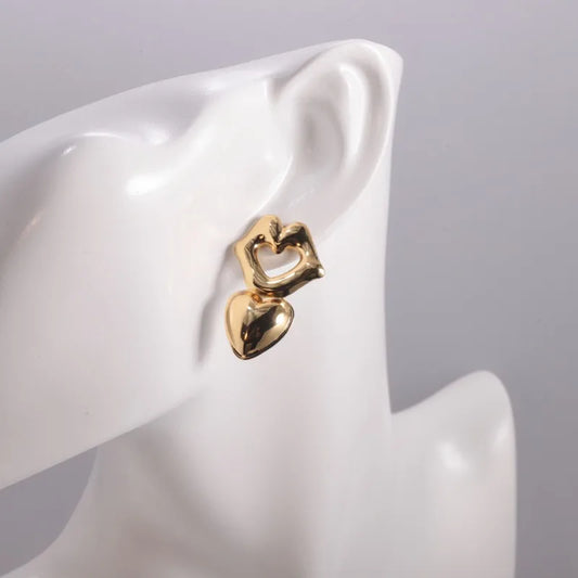 Sculpted open-heart tops paired with molten gold heart drops.