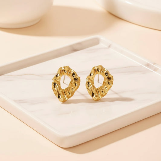Lightweight hollow molten oval gold studs with a bold sculptural shape.