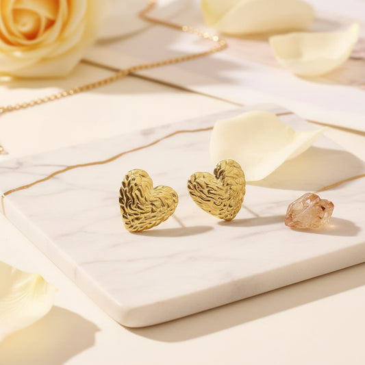 Softly textured gold heart studs for romantic everyday shine.