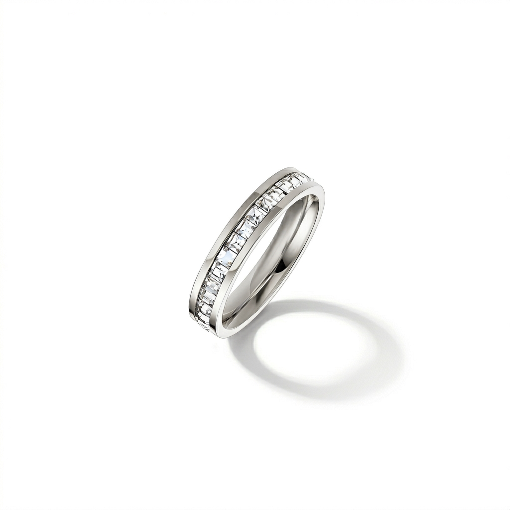Silver ring with embedded diamonds on a white background