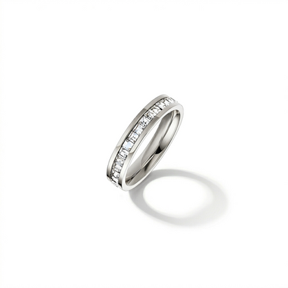 Silver ring with embedded diamonds on a white background