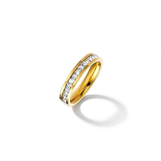 Gold ring with embedded diamonds on a white background