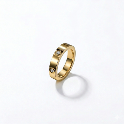 Gold ring with embedded diamonds on a white background