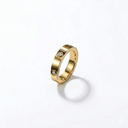 Gold ring with embedded diamonds on a white background